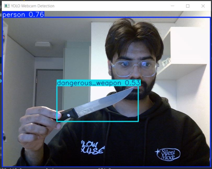 Live detection — person and dangerous weapon detected simultaneously